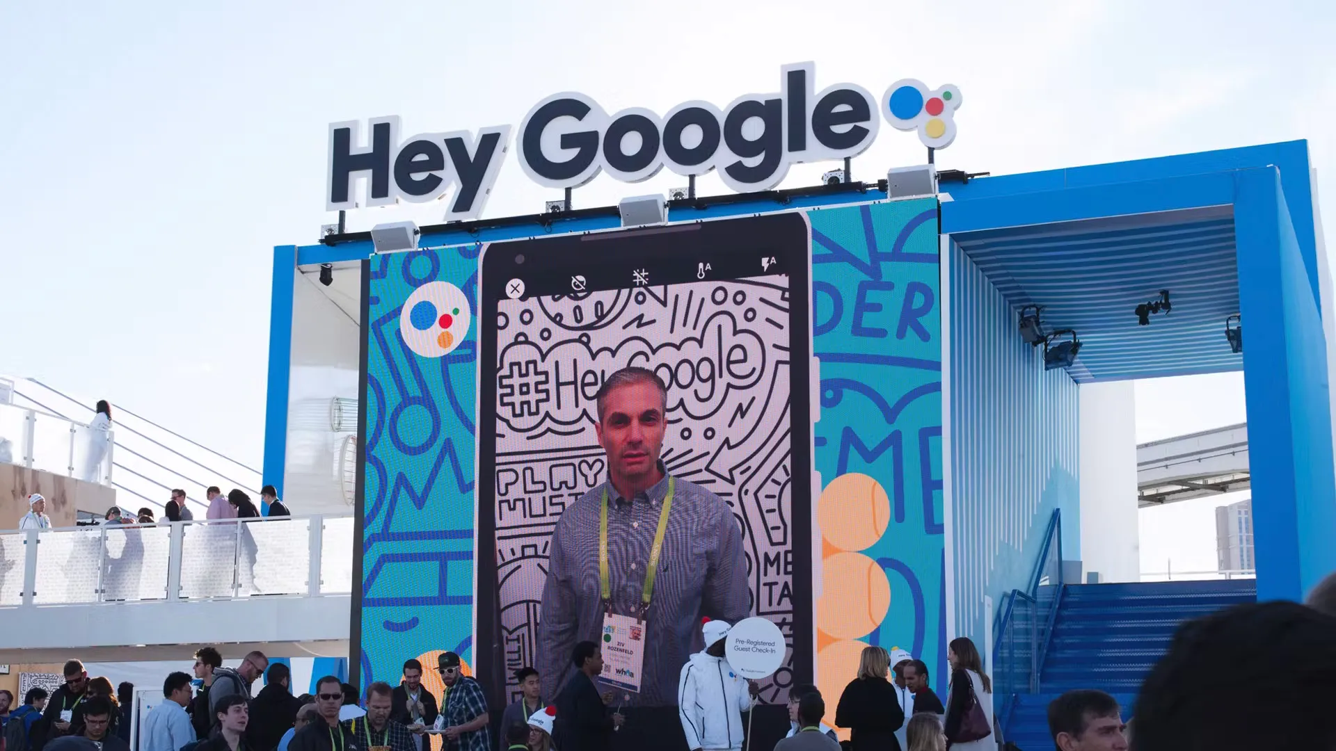 Images from teh Selfie station are shown on the big outdoor screen at Google Assistant Playground CES 2018