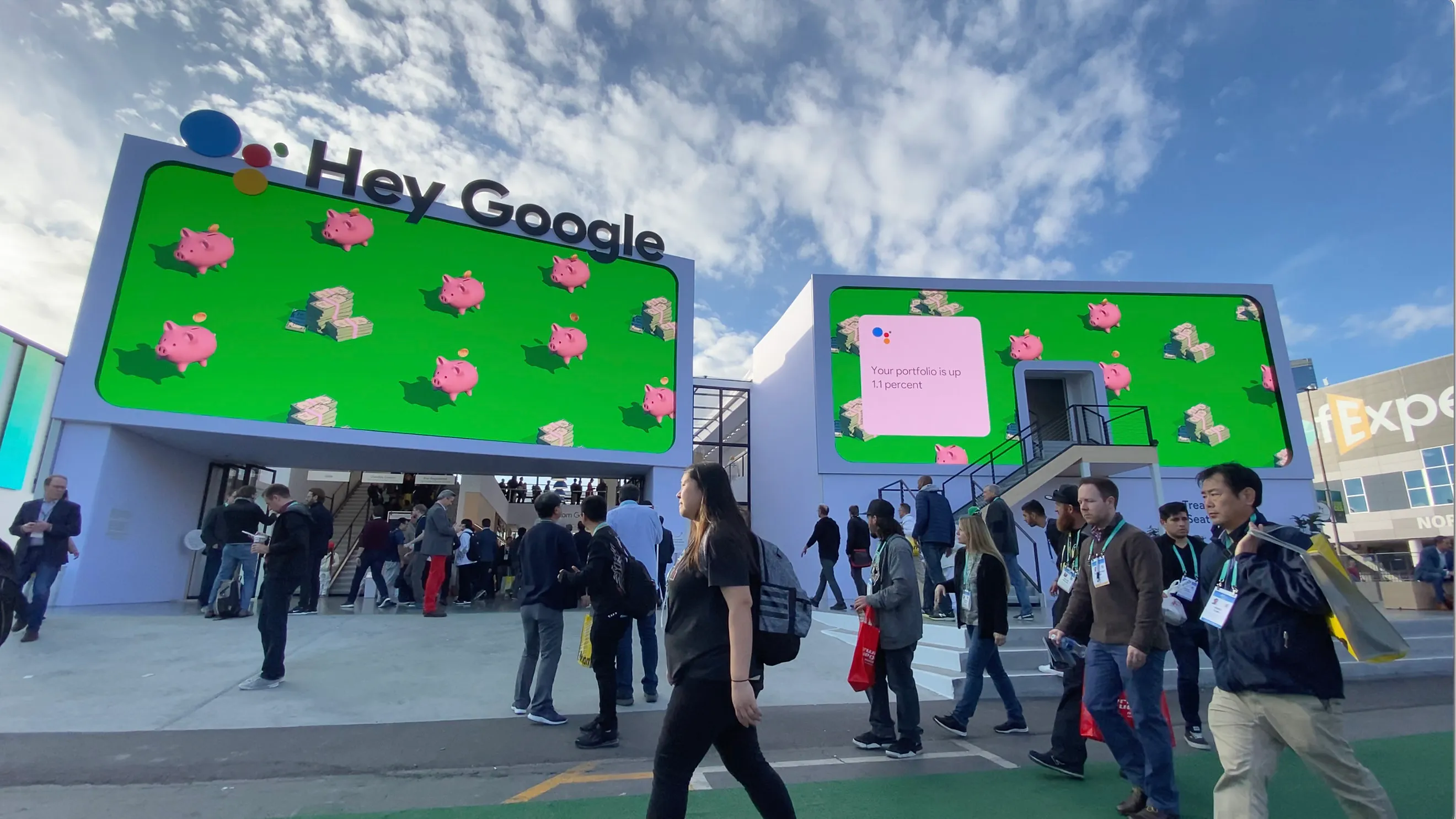 Google Assistant Playground CES 2020 big outdoor screen that shows a slide with a generative and dynami animation grid in the background